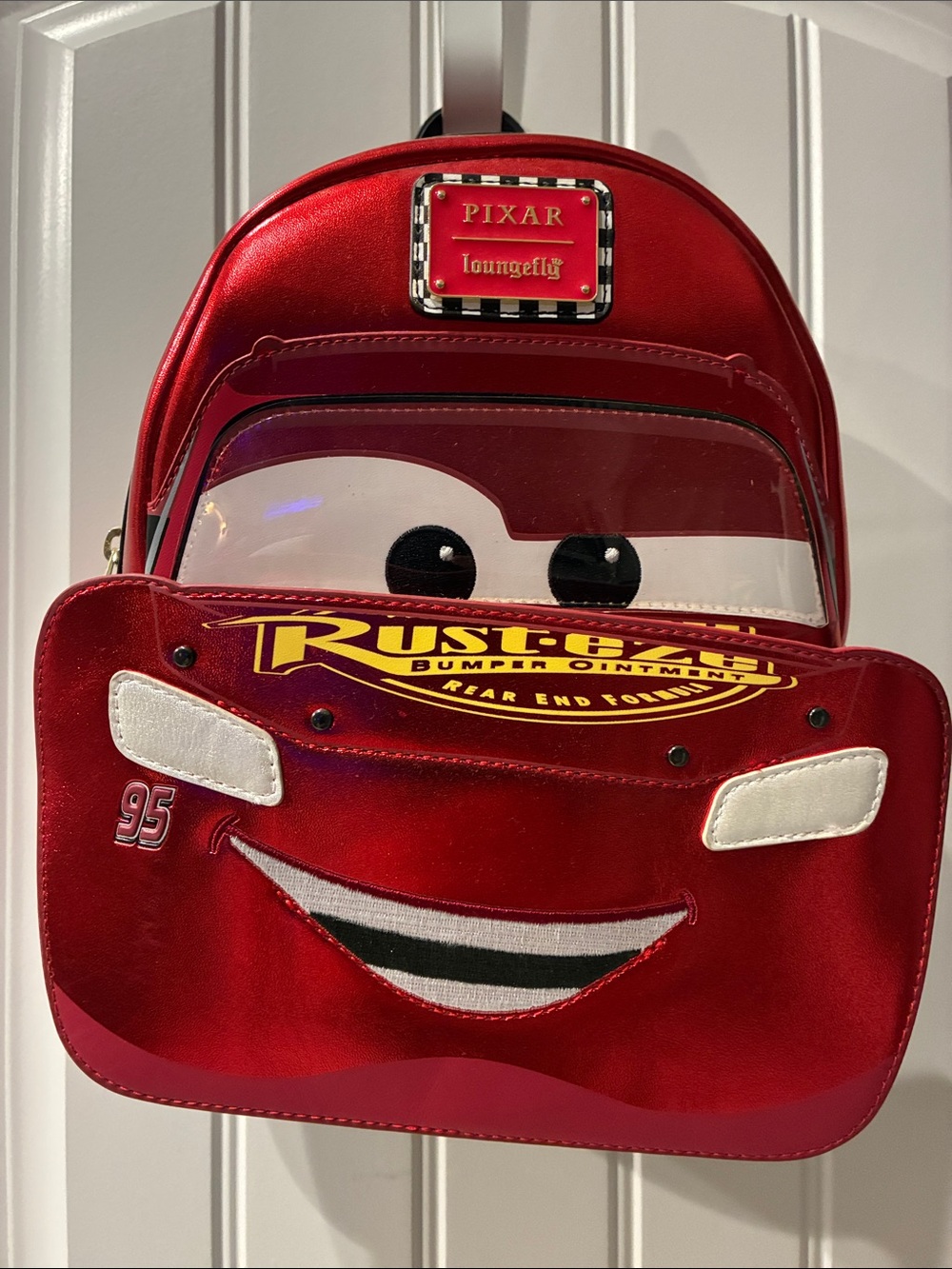 LOUNGEFLY DISNEY PIXAR CARS METALLIC LIGHTNING MCQUEEN
COSPLAY MINI BACKPACK